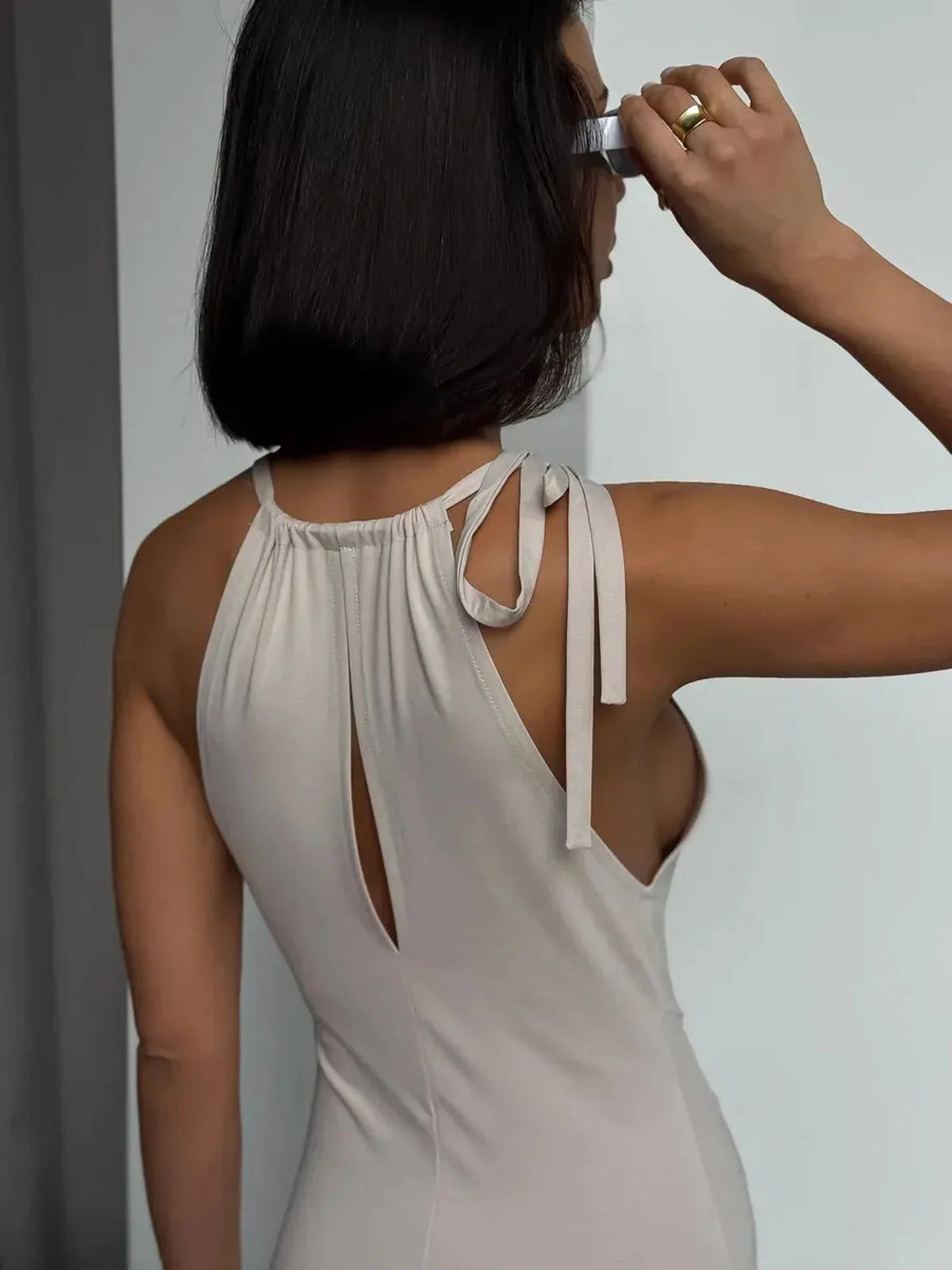 Elegant back view of the Serene Curve Maxi Dress featuring a halter neckline and adjustable tie-back closure.