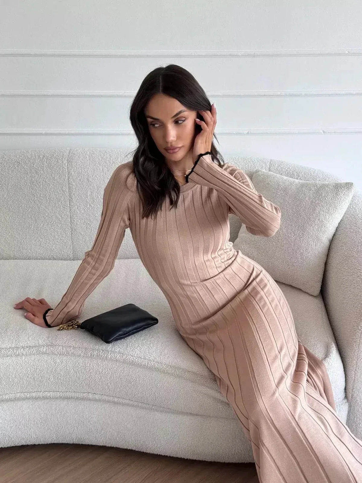 Model wearing Sahara Curve Maxi Dress in sandstone beige, showcasing its elegant ribbed texture and sculpted fit.