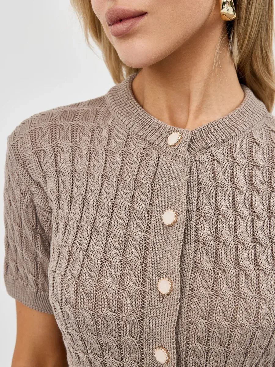 Close-up of a woman wearing the Capri Cardigan by Lauven in cappuccino color with button details.