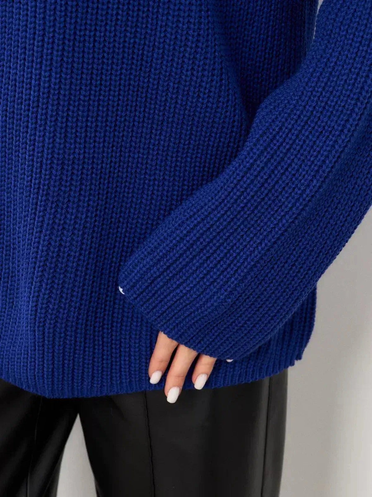 Close-up of the Celeste Sweater by Lauven, showcasing the oversized electric blue knit and relaxed fit.