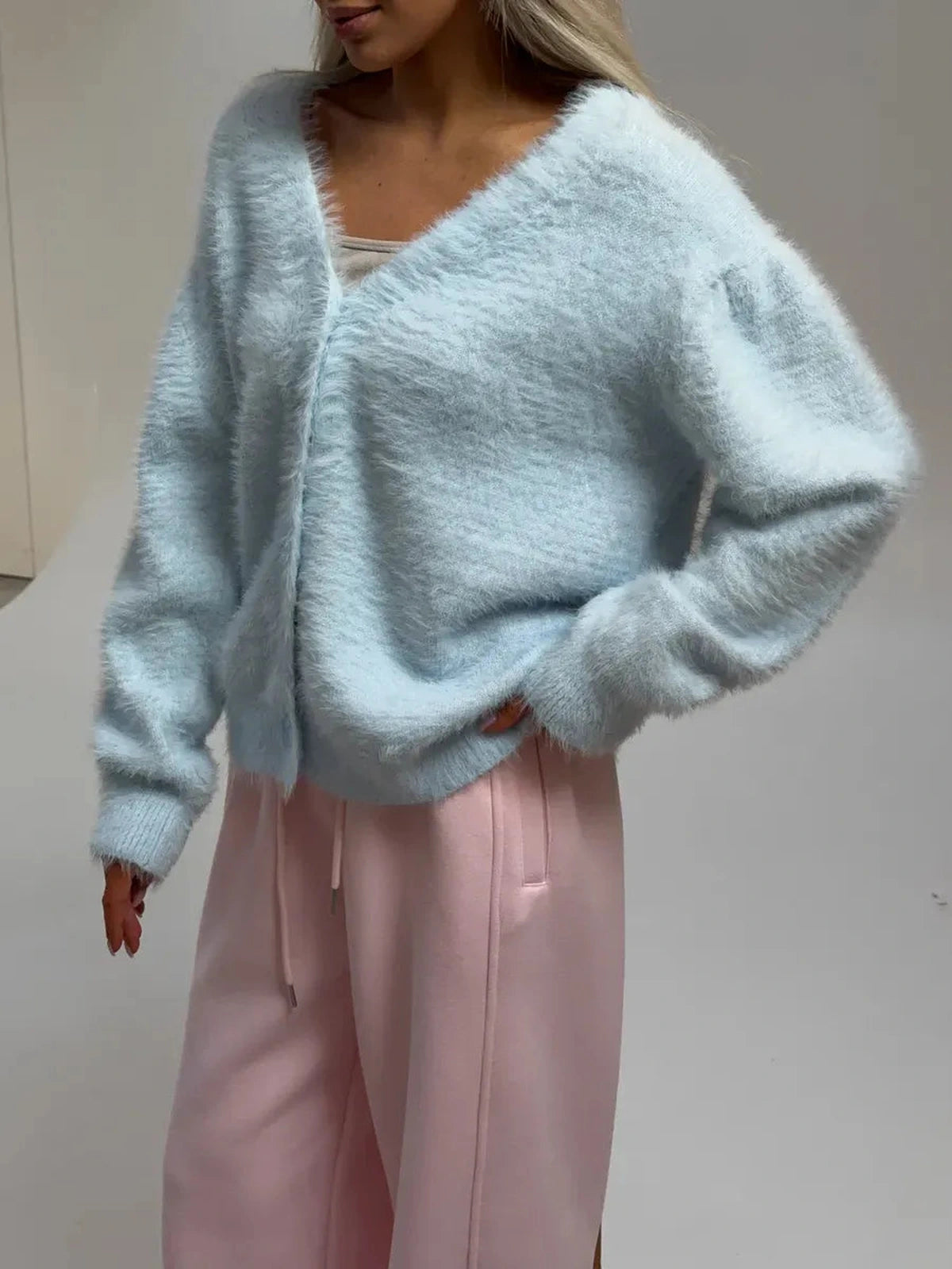 Azure Cardigan by Lauven in oversized light blue fluffy knit with button closure and relaxed fit.