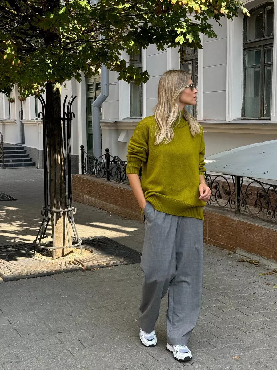 Vesper Sweater by Lauven in pistachio, oversized knit with high turtleneck, styled for fall street fashion.