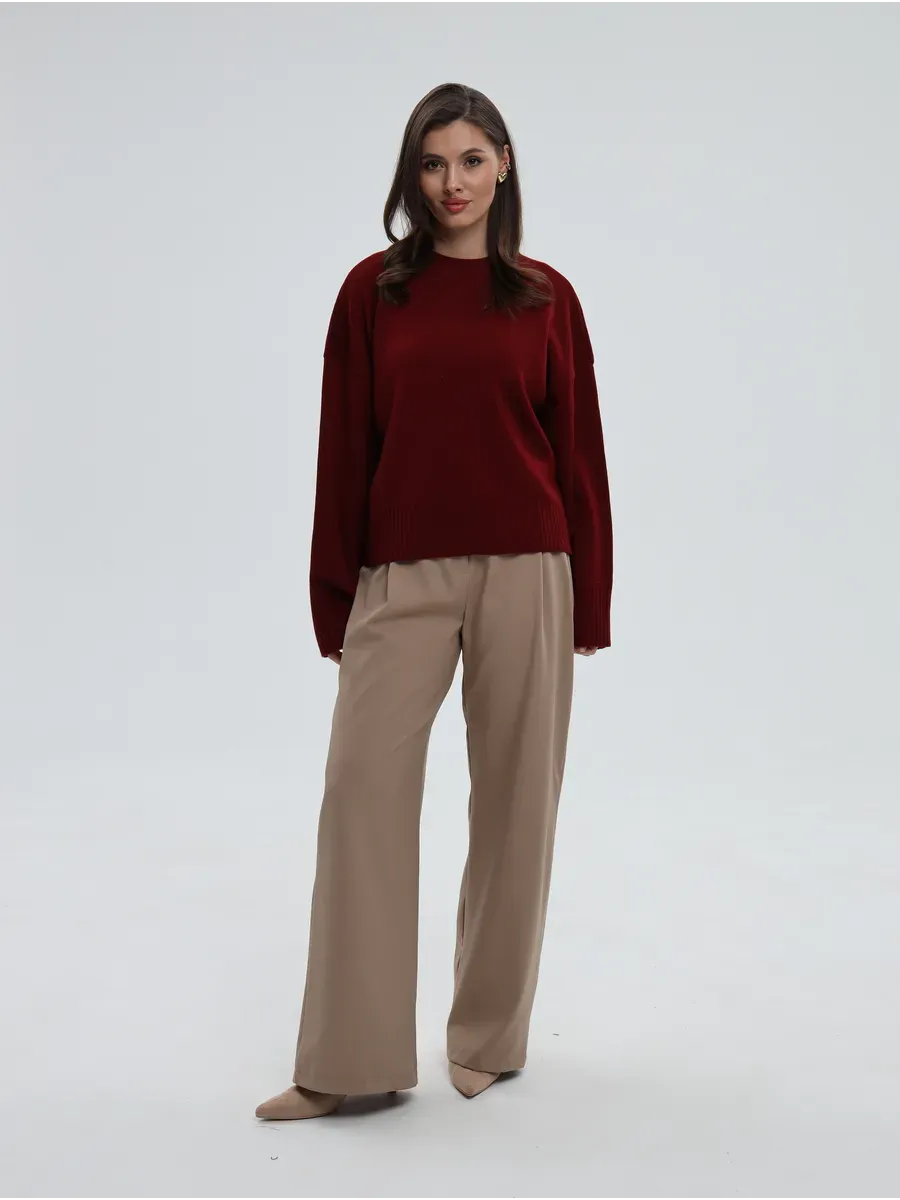 Valora Sweater by Lauven in oversized knit, burgundy red, paired with neutral pants for elegant style.