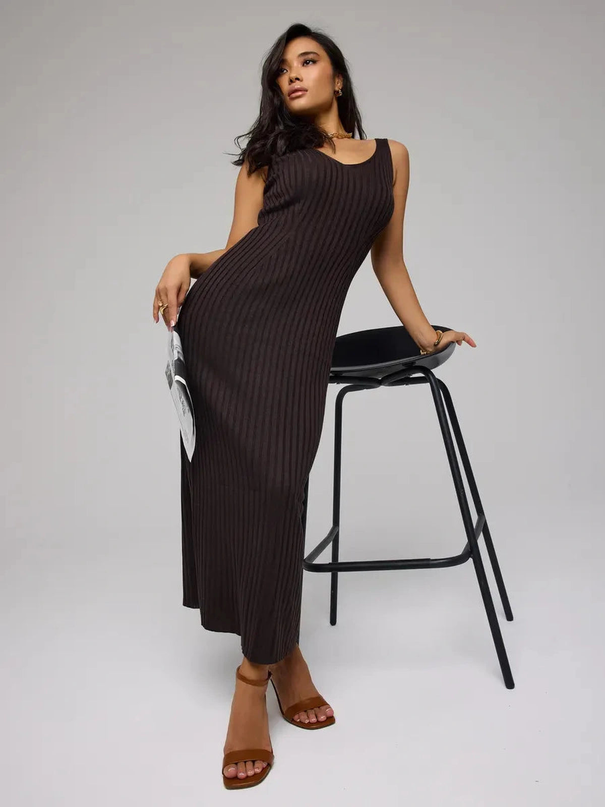 Model showcasing the Cacao Maxi Dress by Lauven, a chic brown ribbed knit dress perfect for any occasion.