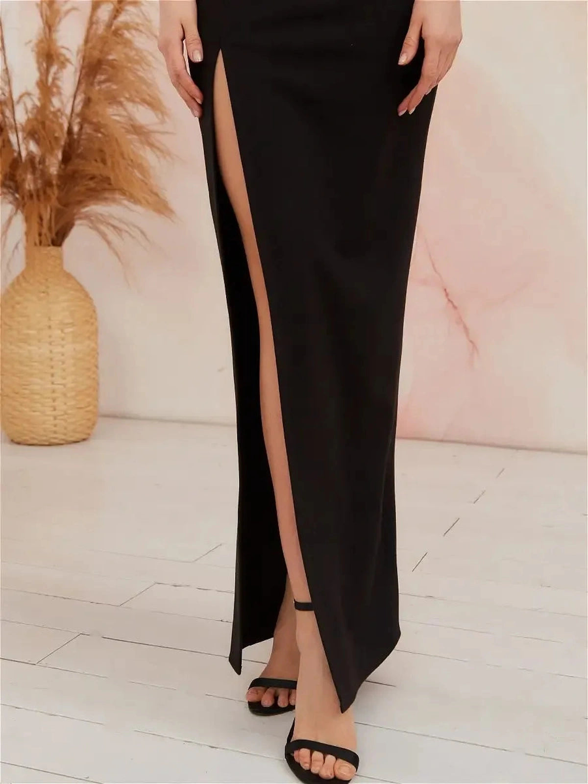 Venosa Maxi Dress by Lauven featuring a stylish front slit and sleek black design for evening elegance.