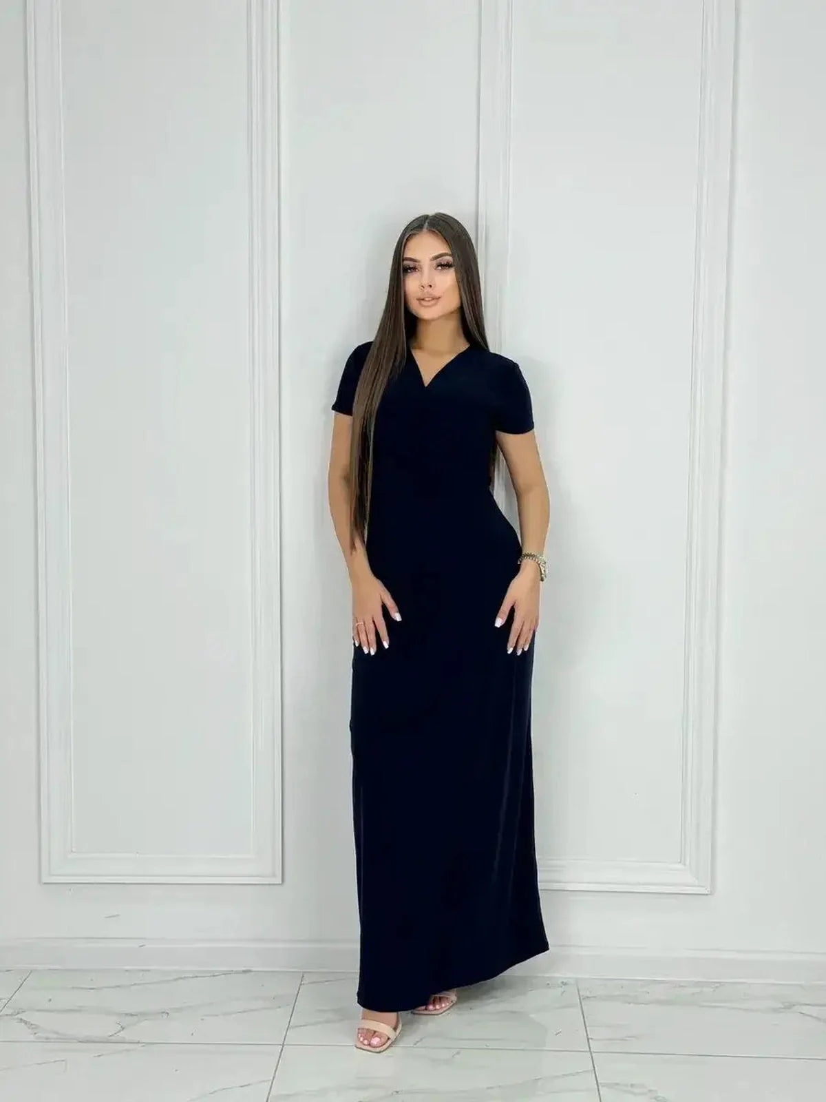 Eclipse Maxi Dress with sleek wrap bodice and side slit in navy, showcasing modern femininity and elegance.