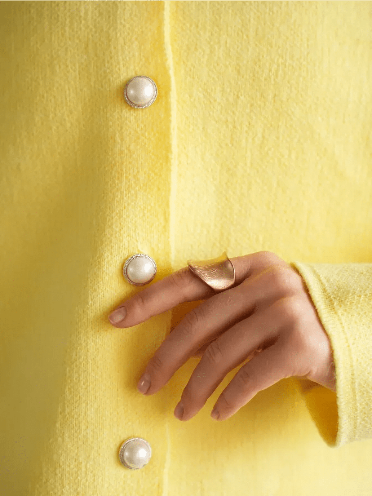Lemonade Cardigan by Lauven featuring a bright yellow knit and pearl button details, perfect for stylish layering.