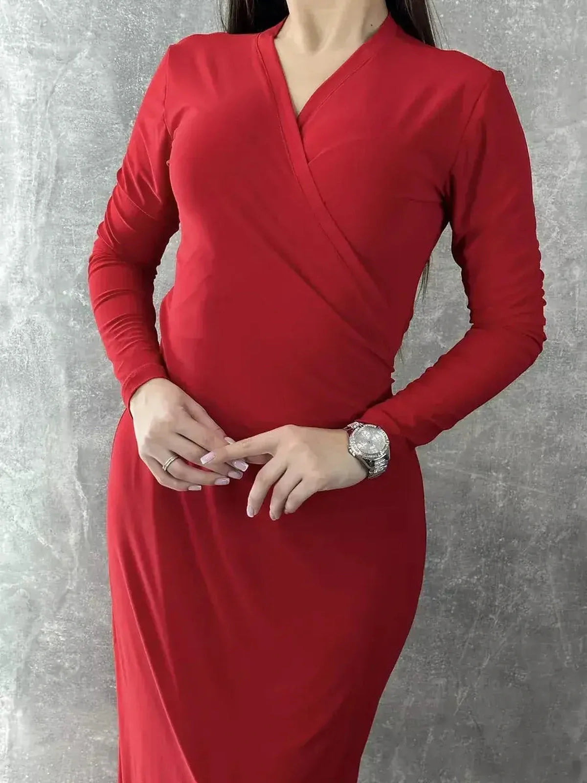 Elegant long sleeve red maxi dress with a wrap silhouette and tie-waist detail, showcasing a sophisticated fit.