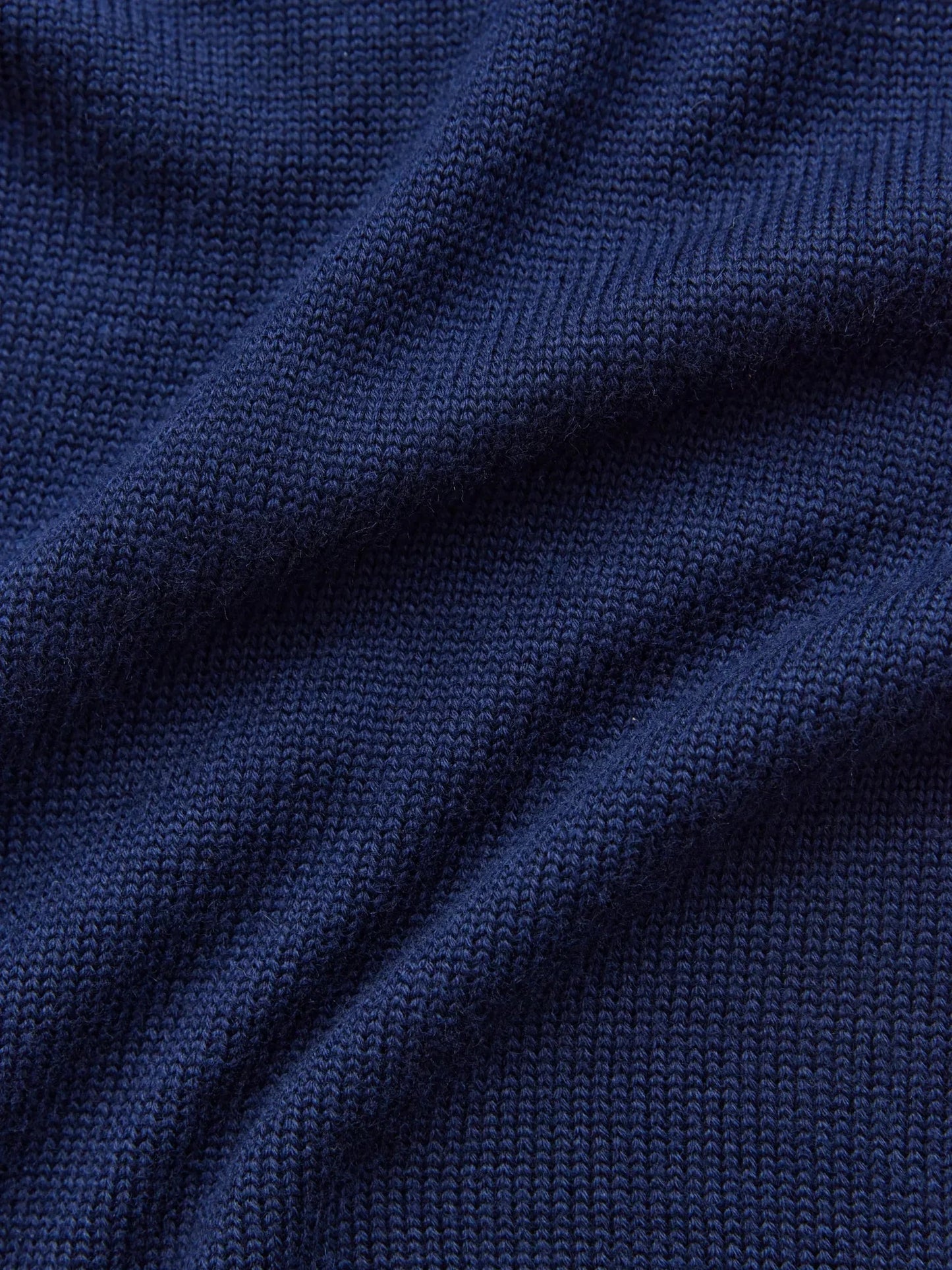 Deep navy knit fabric showcasing the texture of the Celeste Sweater by Lauven, a cozy oversized women’s wool knit.