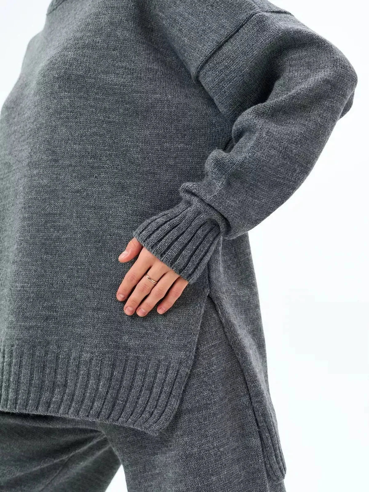 Orion Sweater by Lauven in oversized wool blend knit, showcasing a cozy graphite gray color and stylish side slit.