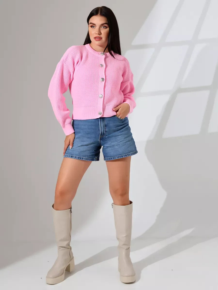 Flora Cardigan by Lauven in soft pink knitwear, styled with denim shorts and knee-high boots.