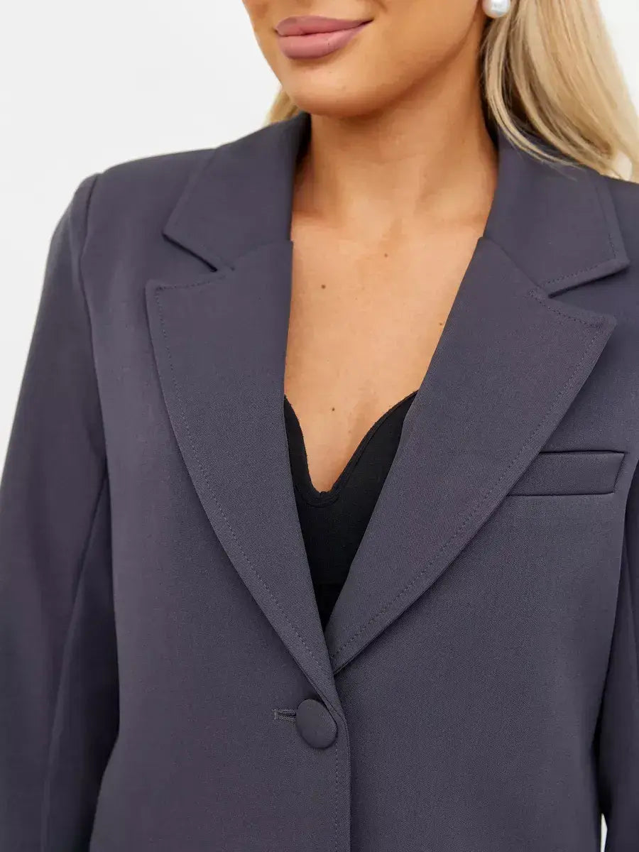 Graphite Blazer by Lauven featuring a tailored cropped silhouette in dark gray, perfect for versatile styling.