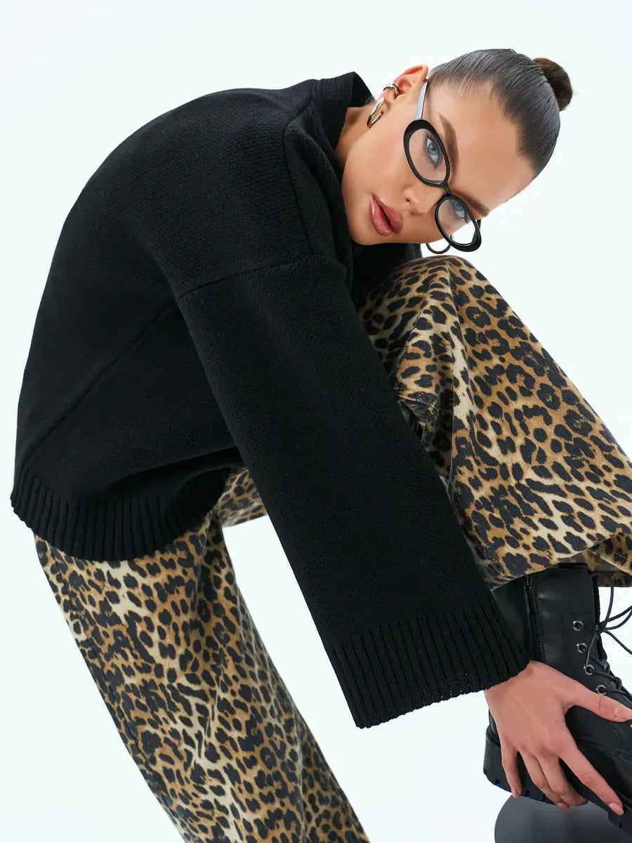 Luna Cardigan by Lauven, cozy oversized knitwear in black, styled with leopard print bottoms for a chic look.