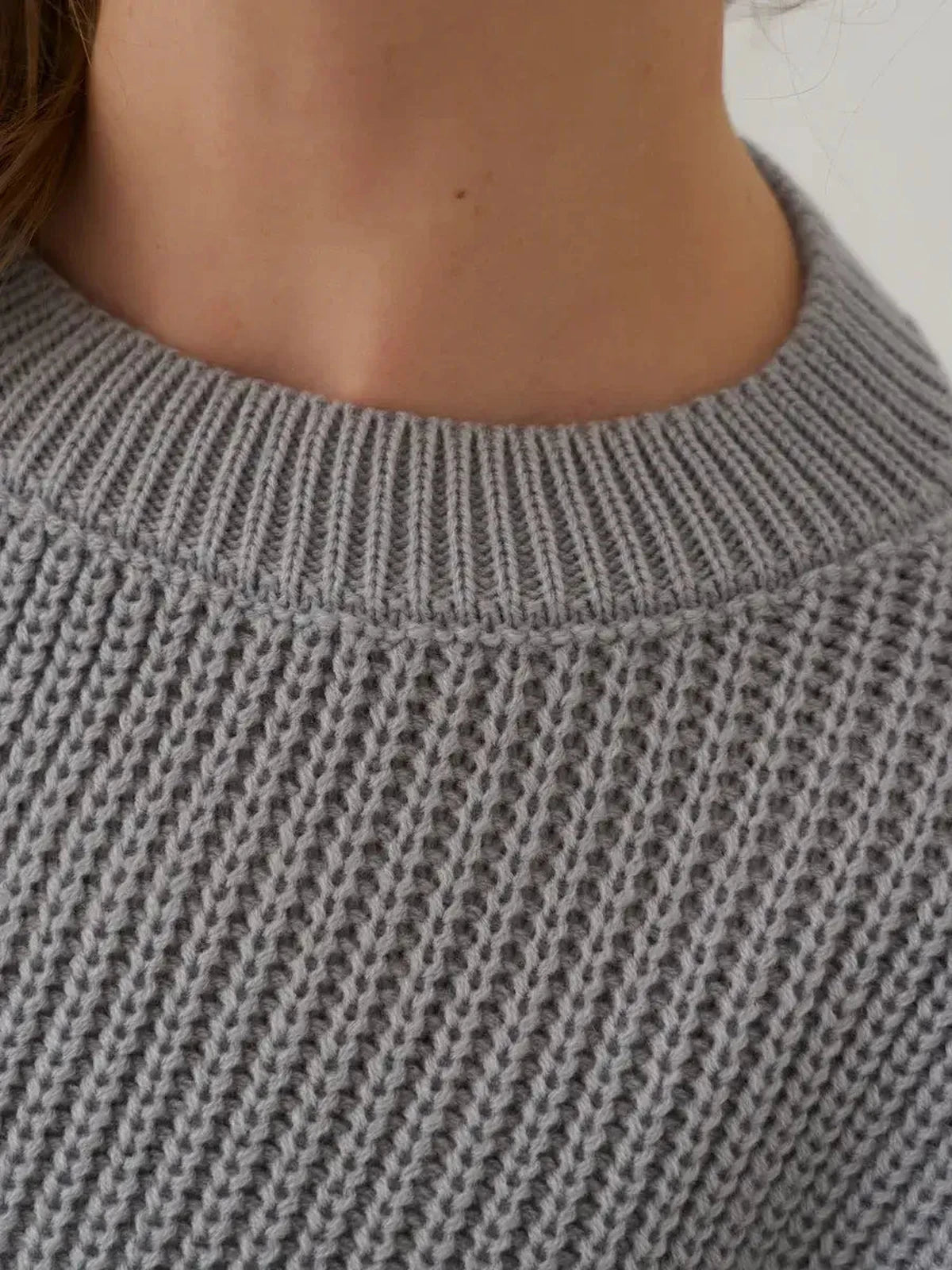 Luna Sweater by Lauven shown in light grey with a cozy rib-knit and round neckline.