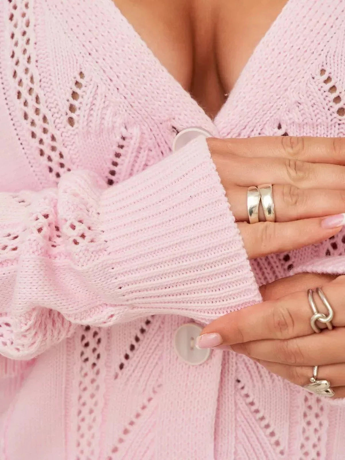 Roselle Cardigan by Lauven featuring pink knit detail and button closure showcasing feminine elegance.