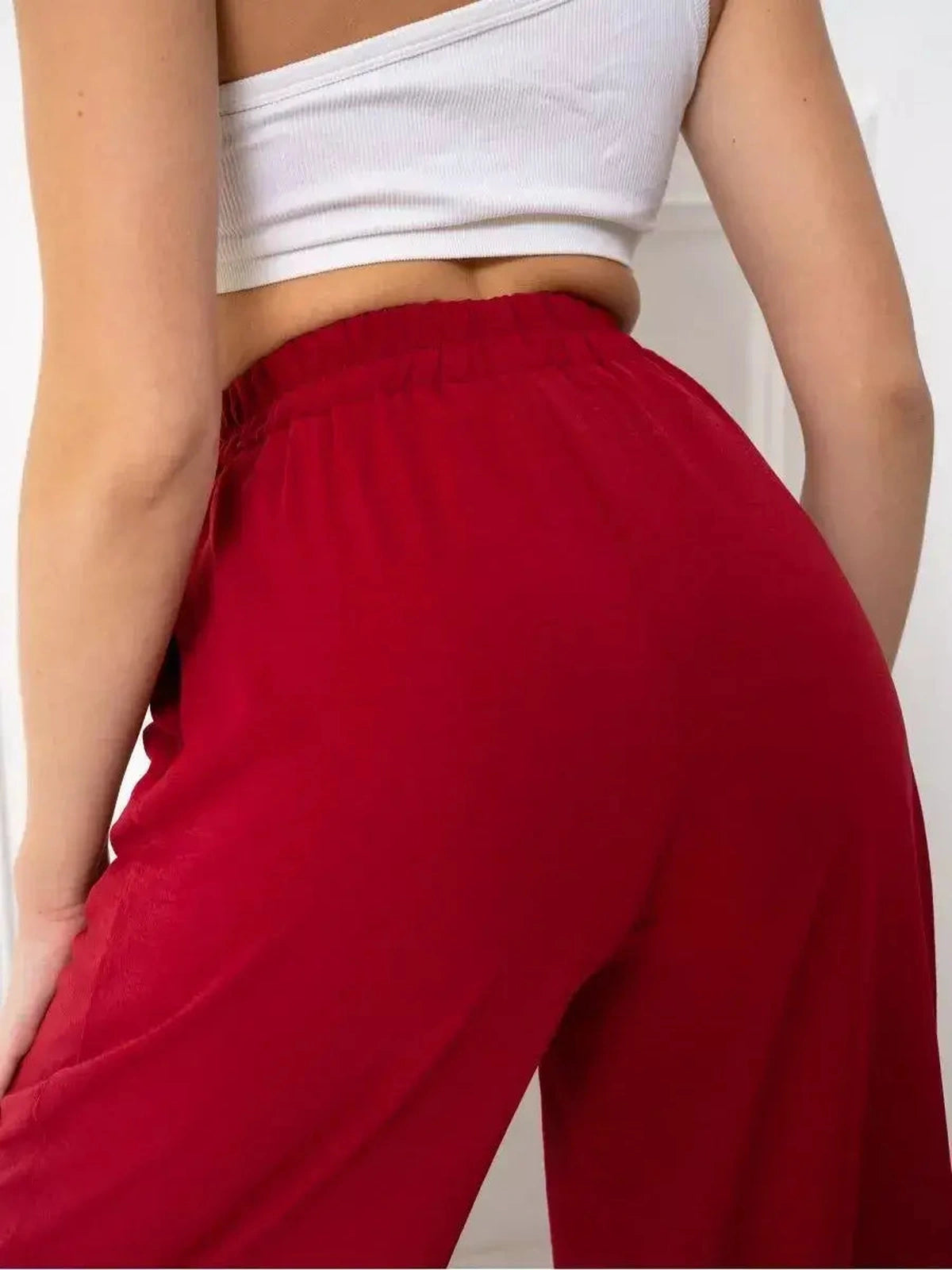 Ruby Suit Set by Lauven featuring vibrant red wide-leg trousers for a stylish and comfortable look.