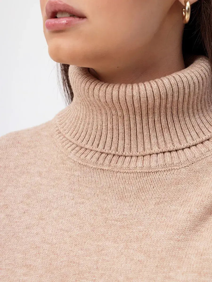 Close-up of the Selene Sweater by Lauven, featuring a dark beige turtleneck for a cozy, stylish look.
