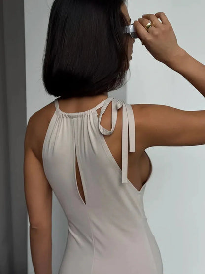 Elegant back view of the Serene Curve Maxi Dress featuring a halter neckline and adjustable tie-back closure.