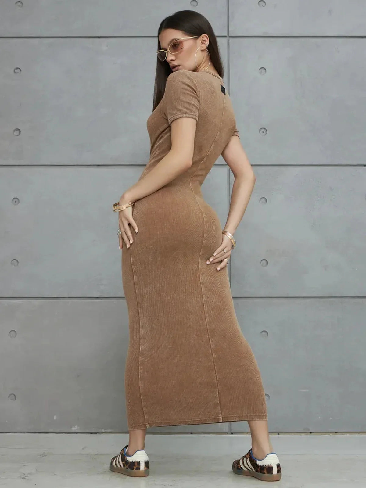 Stylish model showcasing the Sculpted Ease Maxi Dress in washed tobacco, highlighting its flattering fit and sleek design.