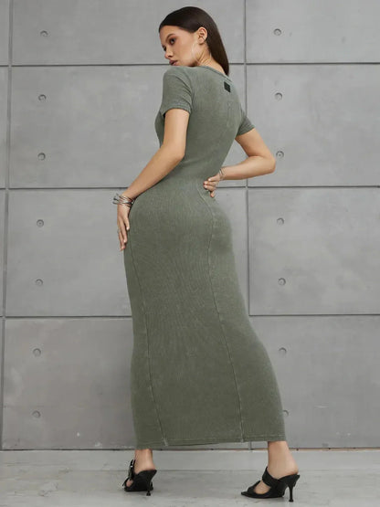 Olive Line Maxi Dress in khaki green ribbed cotton, showcasing a fitted silhouette and precise seam detailing.