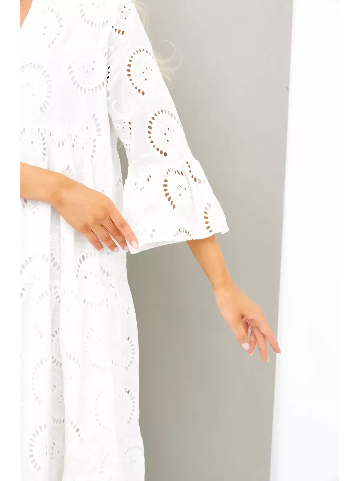 Close-up of Broderie Cotton Maxi Dress showing flared sleeves and intricate embroidery detail.