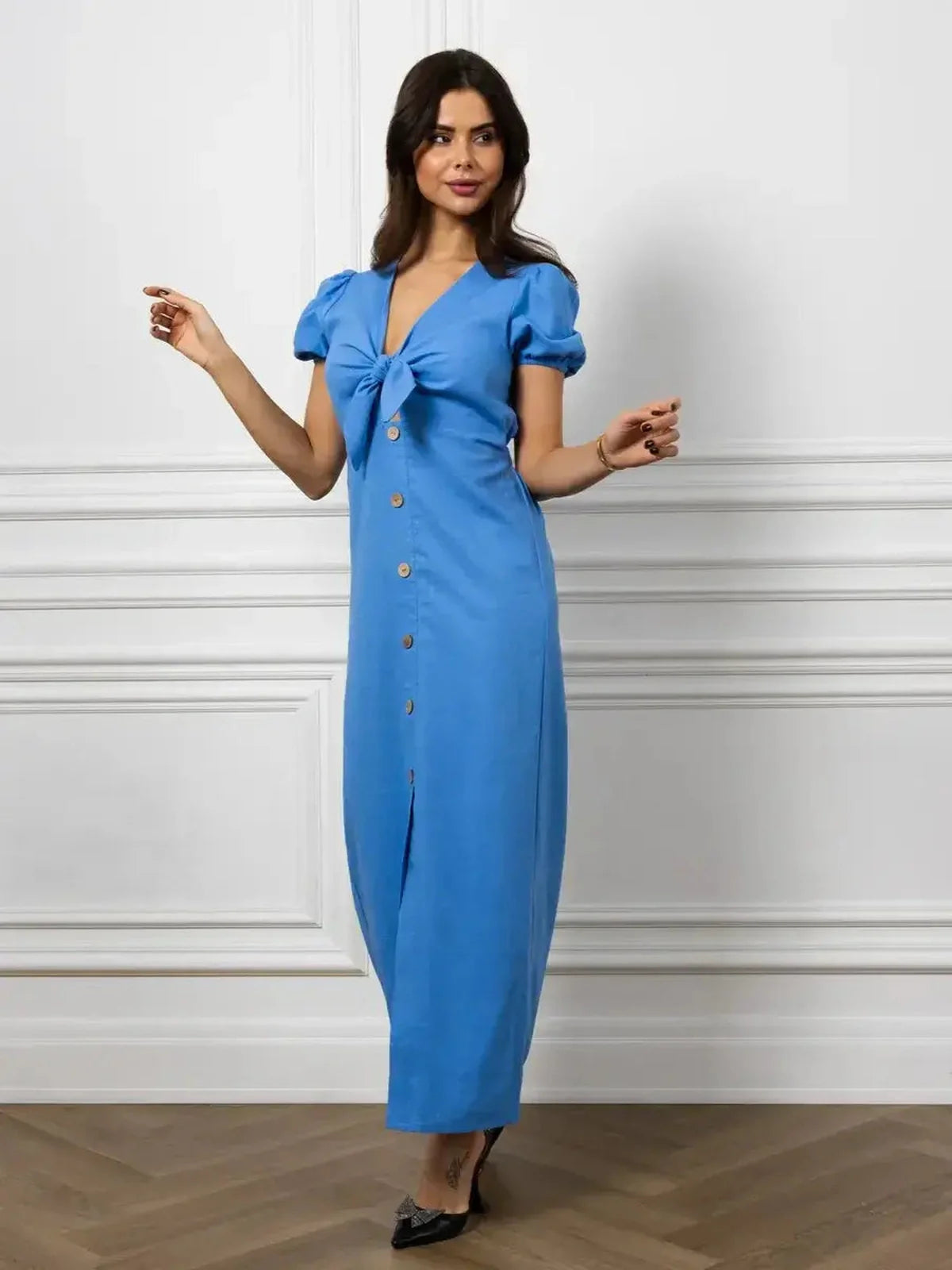 Maxi Dress Azure Charm with V-neckline, waist tie, and button details, embodying elegance in sky blue.