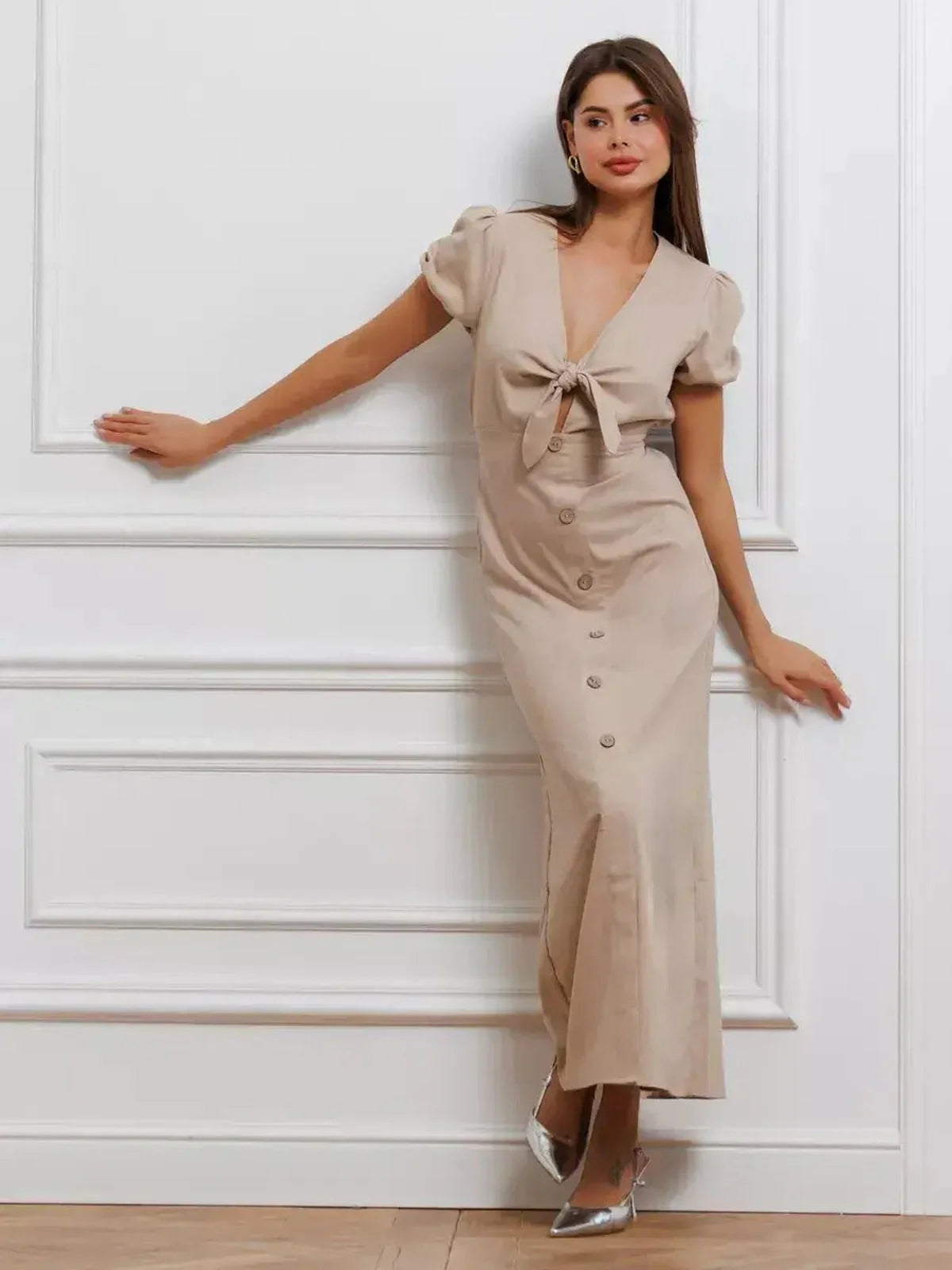 Model wearing the Serene Bond Maxi Dress with puff sleeves and tie-front detail, showcasing timeless elegance.