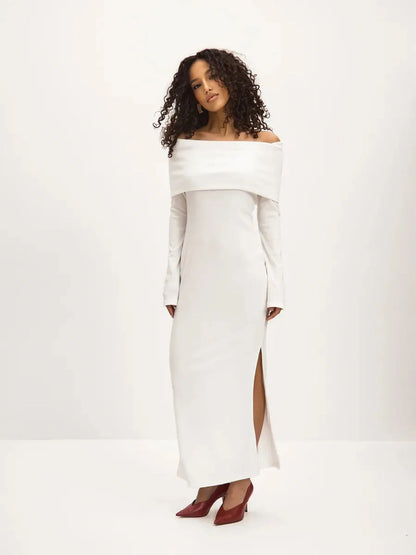 Sculpted Grace Maxi Dress in white, featuring off-shoulder silhouette and side slit for elegant, sensual style.