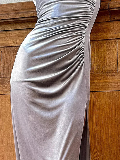 Close-up of the Starlight Maxi Dress, showcasing its sleek silver velvet fabric and elegant draping details.