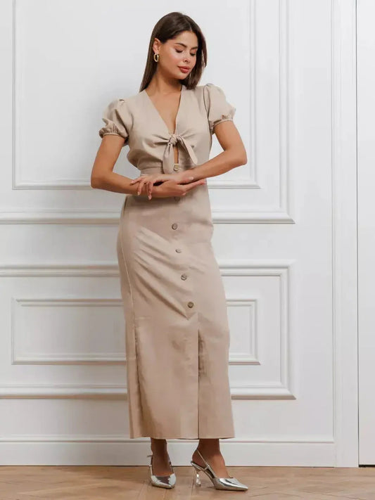 Serene Bond Maxi Dress with puff sleeves and waist tie, showcasing elegant silhouette in soft neutral hue.