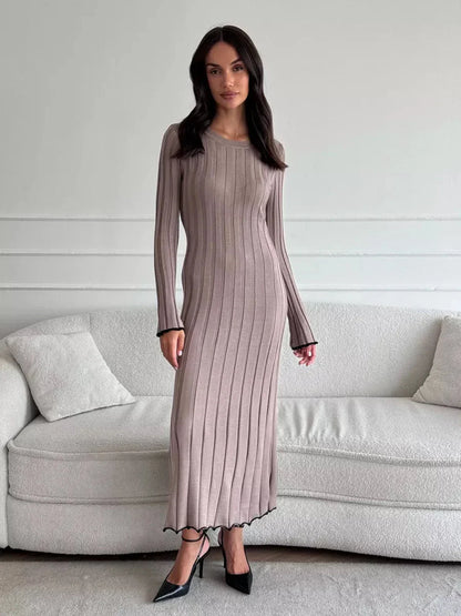 Contemporary Contour Maxi Dress in ribbed knit, featuring a full-length silhouette and elegant ruffle hem.