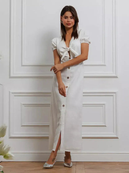 Maxi Dress Pearl Whisper featuring a tie-front bodice and puff sleeves, exuding minimalist sophistication.