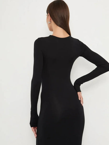 Back view of the Sculpted Noir black dress showcasing its long sleeves and sleek silhouette.