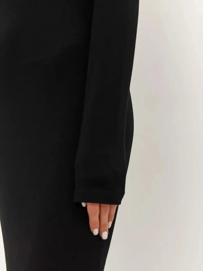 Close-up of the long sleeve of the Noir Maxi Dress showcasing its minimalist design and seamless fit.