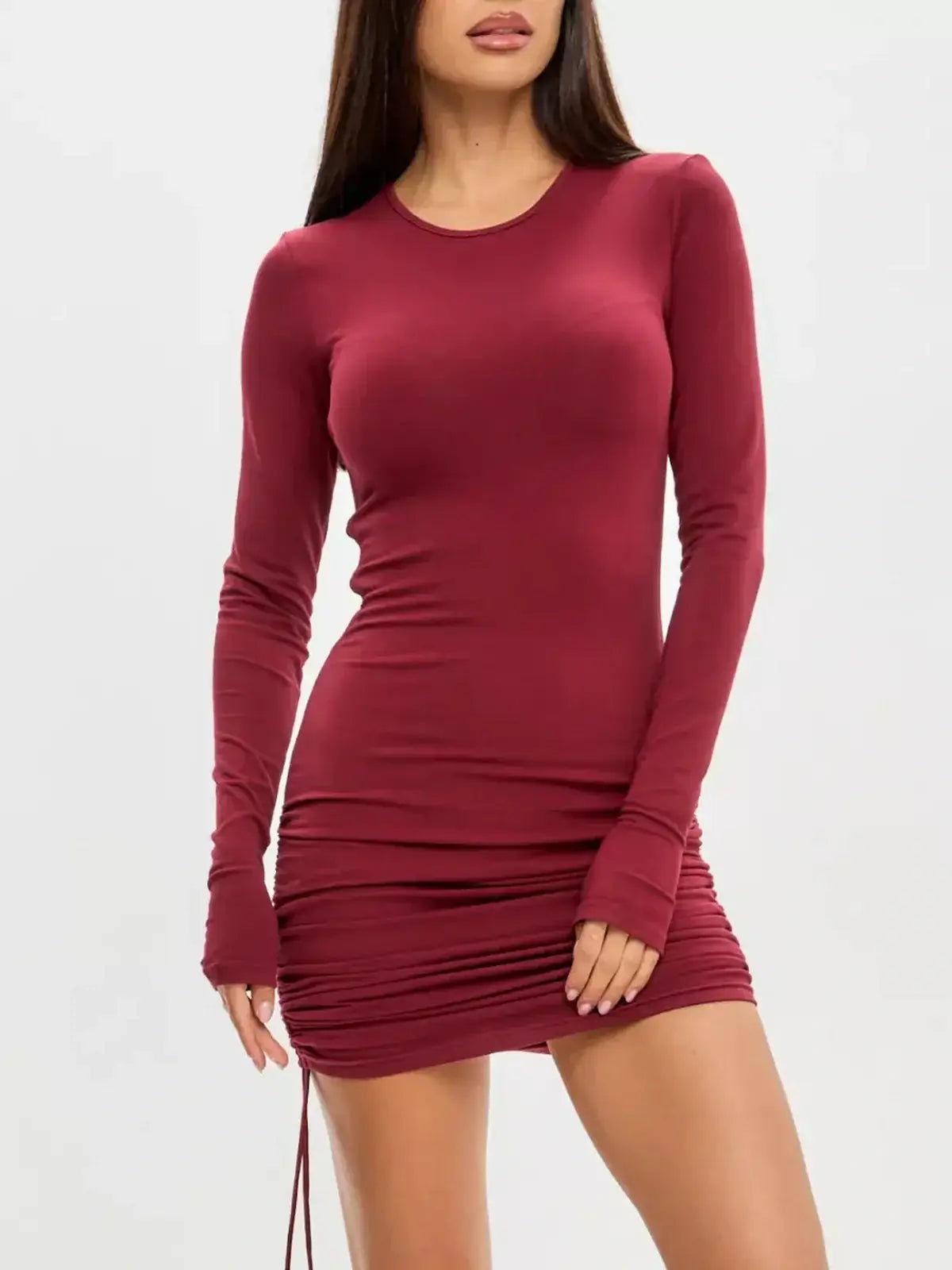 Burgundy long sleeve mini dress with side draping, perfect for weddings and parties.
