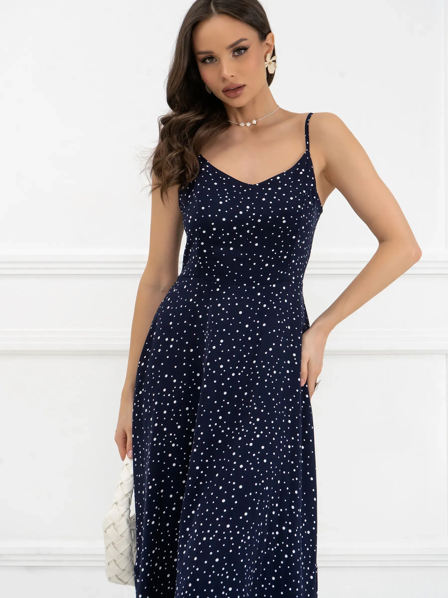 Noir Dots Maxi Dress featuring a flattering A-line cut, micro-polka dots, and lightweight fabric for elegant movement.