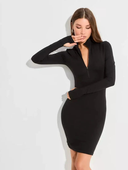 Stylish woman in a sleek black long sleeve mini dress with front zip detail, perfect for events or parties.