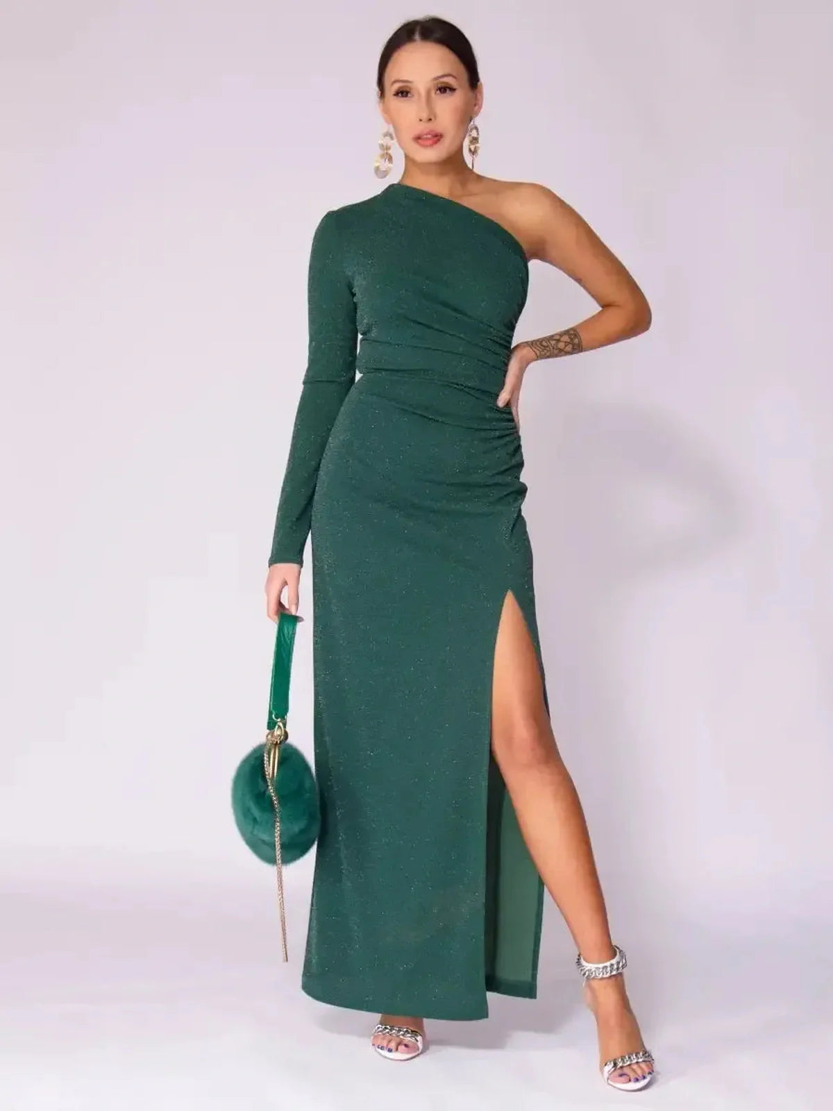 Emerald Spark Maxi Dress featuring a one-shoulder design, high slit, and shimmer, perfect for elegant occasions.