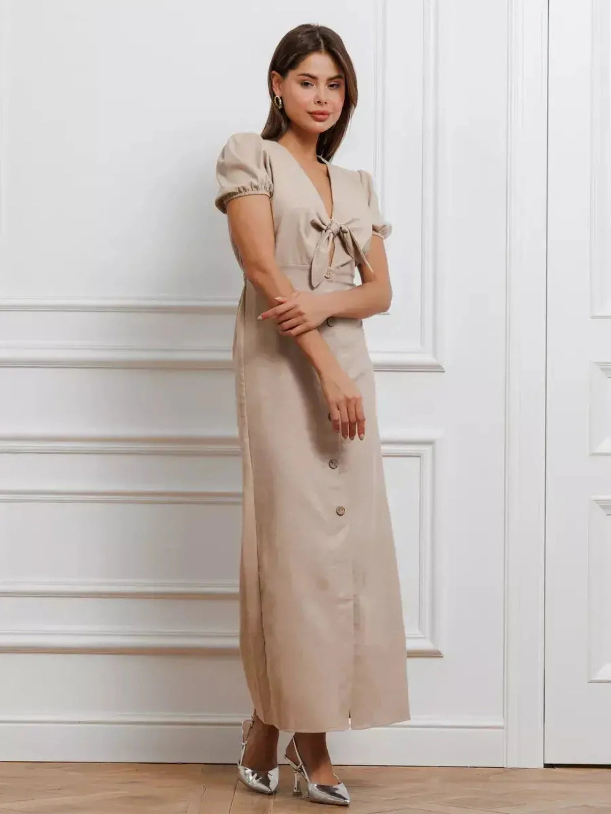 Serene Bond Maxi Dress with refined puff sleeves and waist tie, showcasing understated elegance in a soft neutral hue.