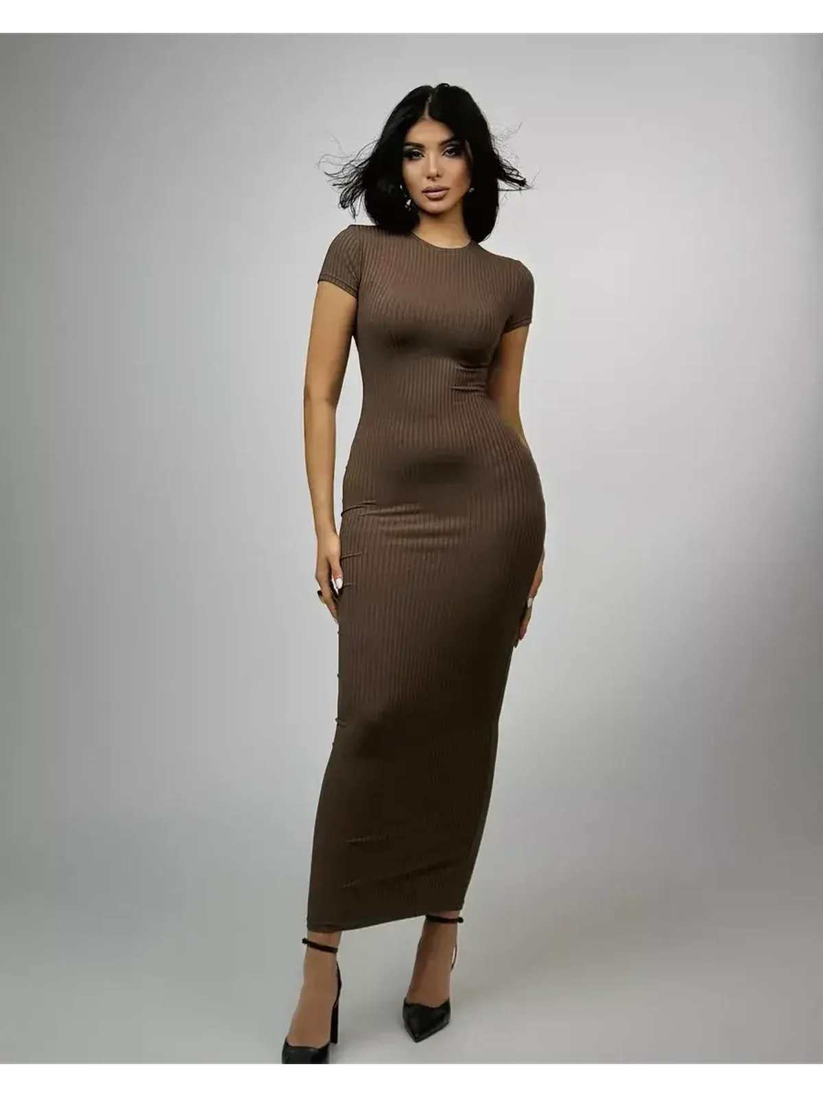 Chocolate-hued maxi dress with ribbed texture and sleek silhouette, perfect for elegant and minimalistic style.