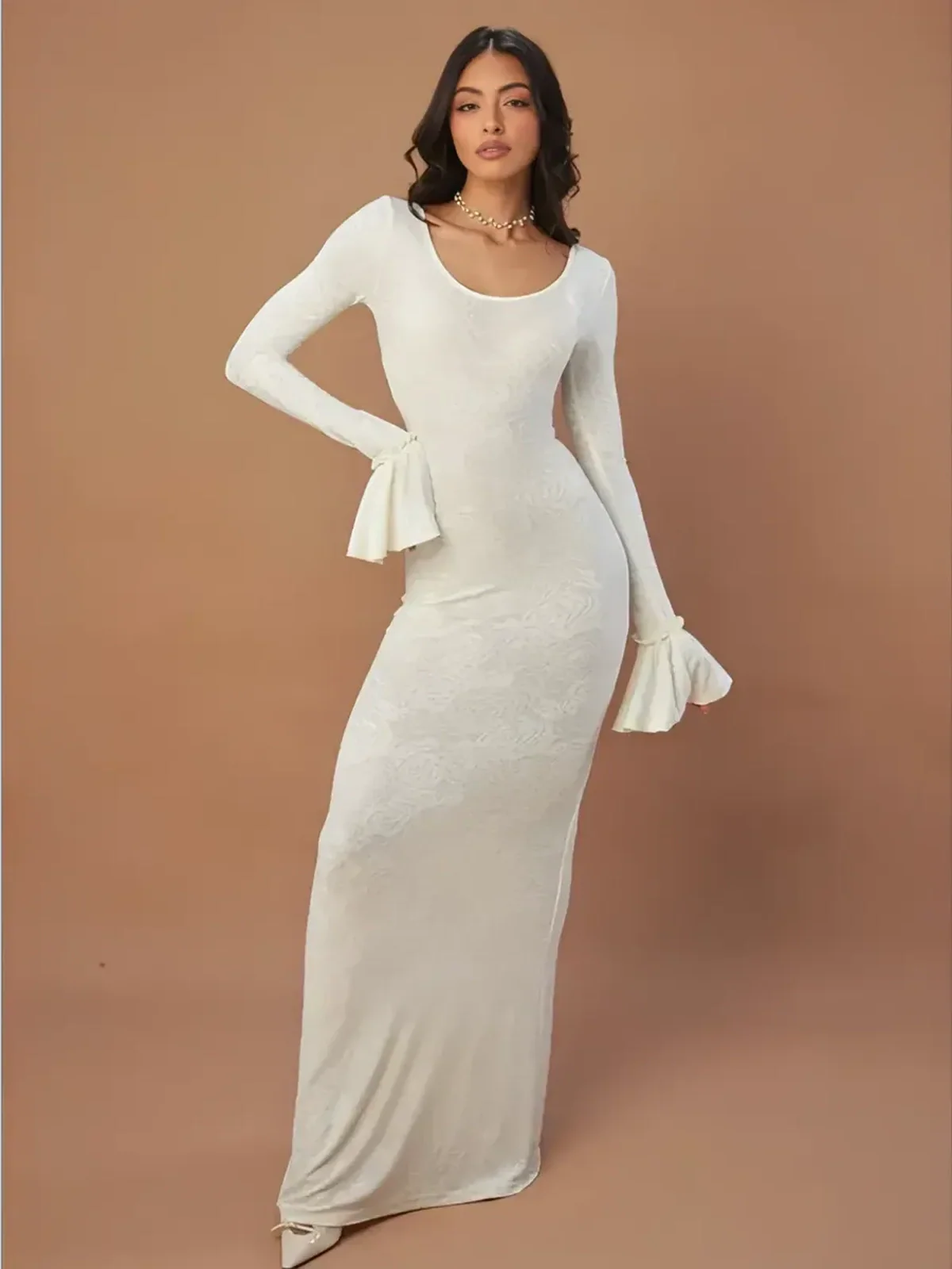 Floral Elegance Maxi Dress in white featuring flared bell sleeves and a soft U-neckline for a sculpted, feminine silhouette.