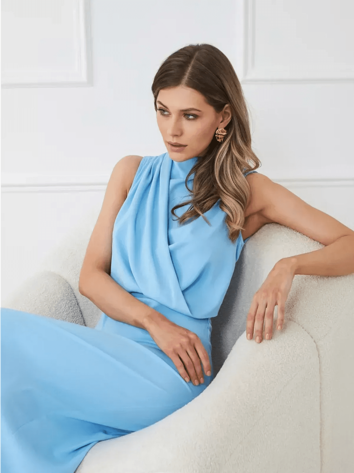 Model wearing the Sculpted Grace Maxi Dress in light blue, showcasing its sleek draped silhouette and elegant design.