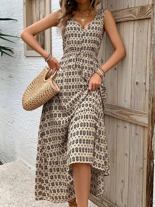 Model wearing the Solana Maxi Dress in a boho print, showcasing its sleeveless design and tiered skirt.