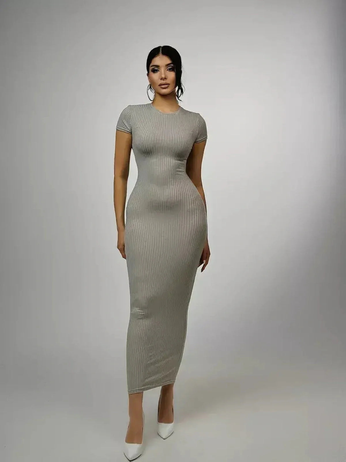 Sculpted Grace Maxi Dress in soft ribbed knit, featuring a figure-hugging silhouette and modern elegance for casual wear.