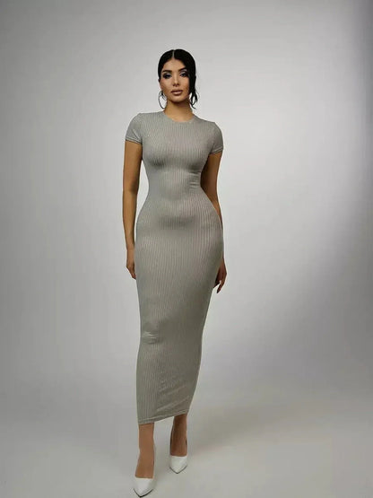 Sculpted Grace Maxi Dress in soft ribbed knit, featuring a figure-hugging silhouette and modern elegance for casual wear.