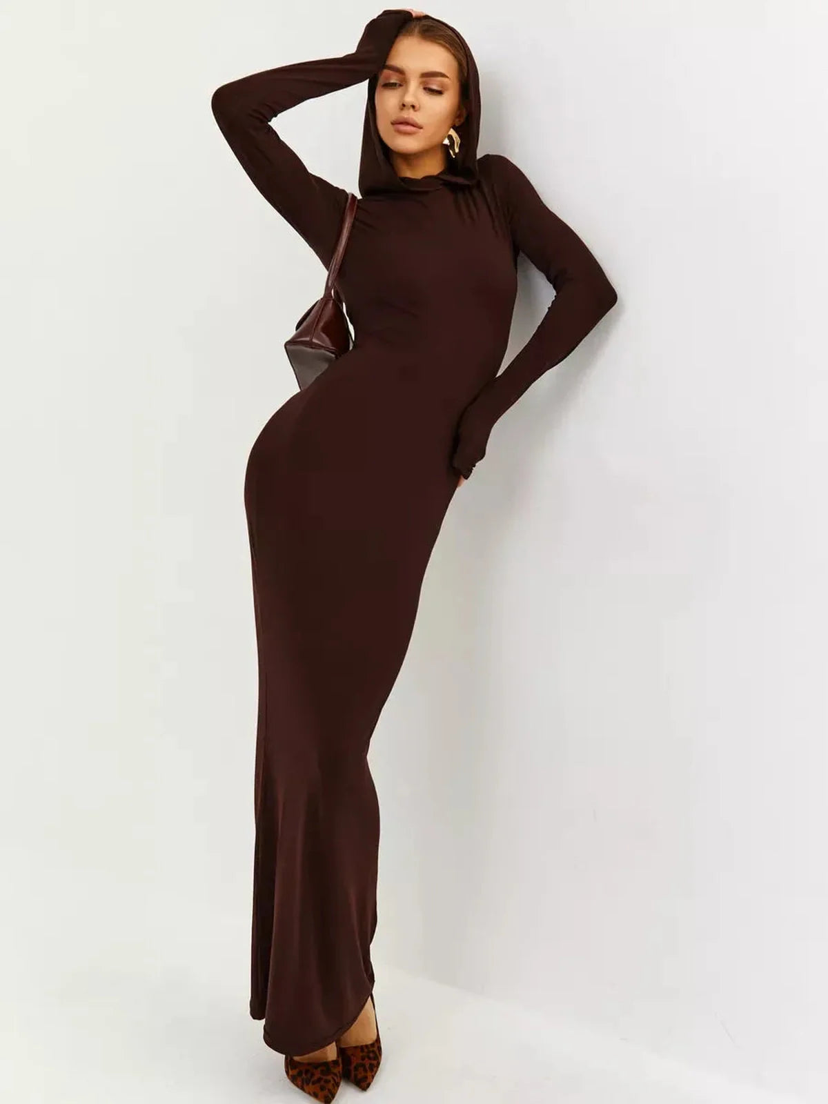Elegant brown hooded Sculpt Maxi Dress showcasing a sleek silhouette and modern style.