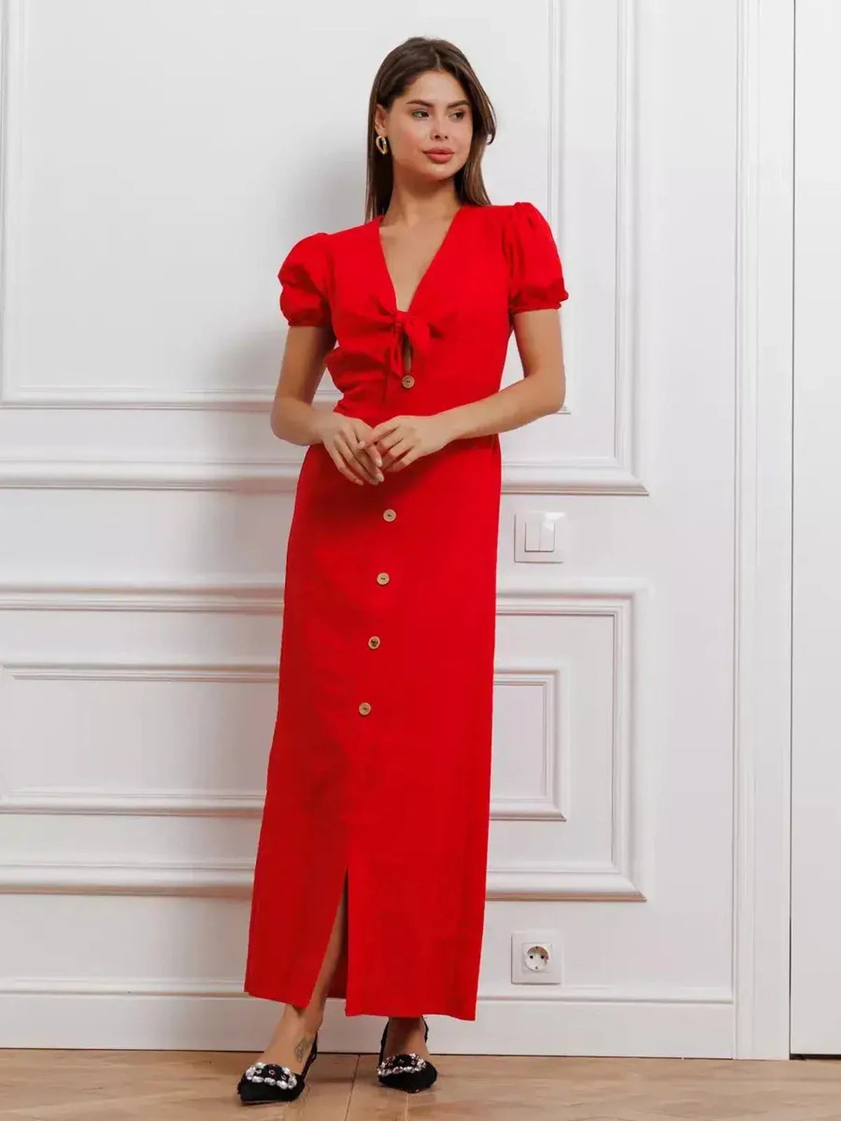 Maxi Dress Riviera Flame in bold red with tie-front detail and puff sleeves, showcasing elegant style and sophistication.