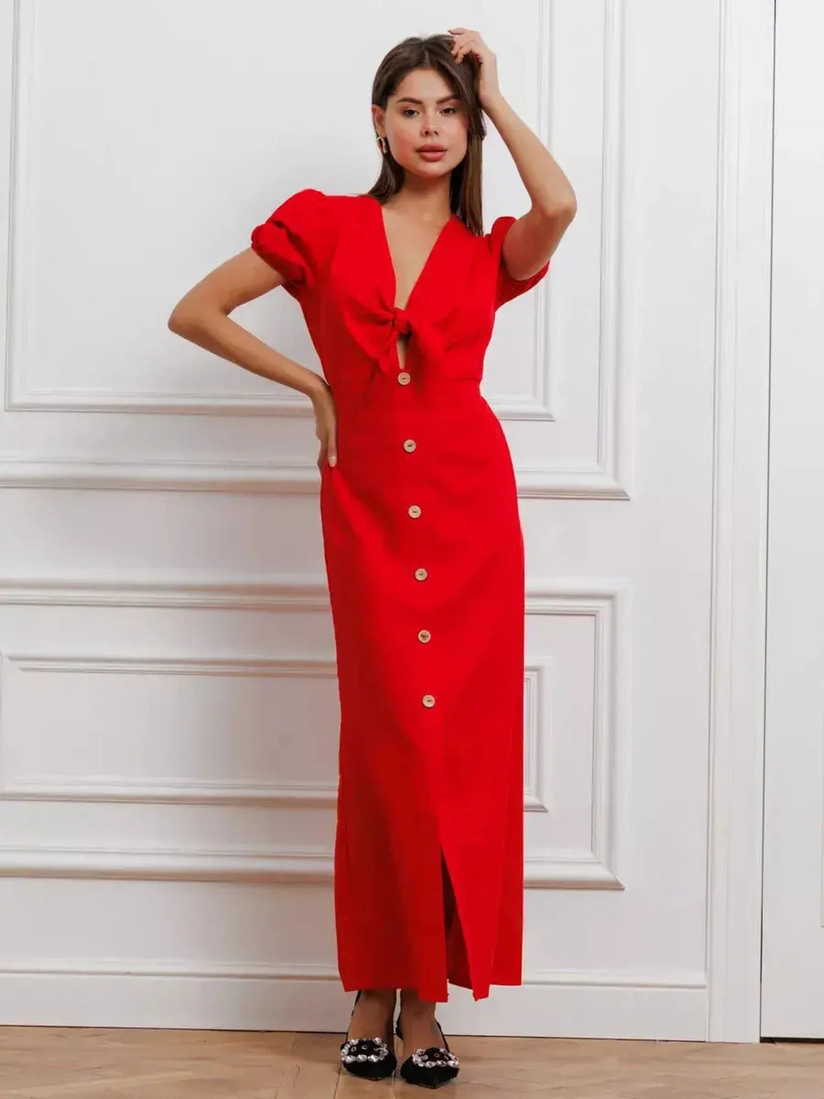 Maxi Dress Riviera Flame in vibrant red with tie-front and puff sleeves, showcasing elegance and sophistication.