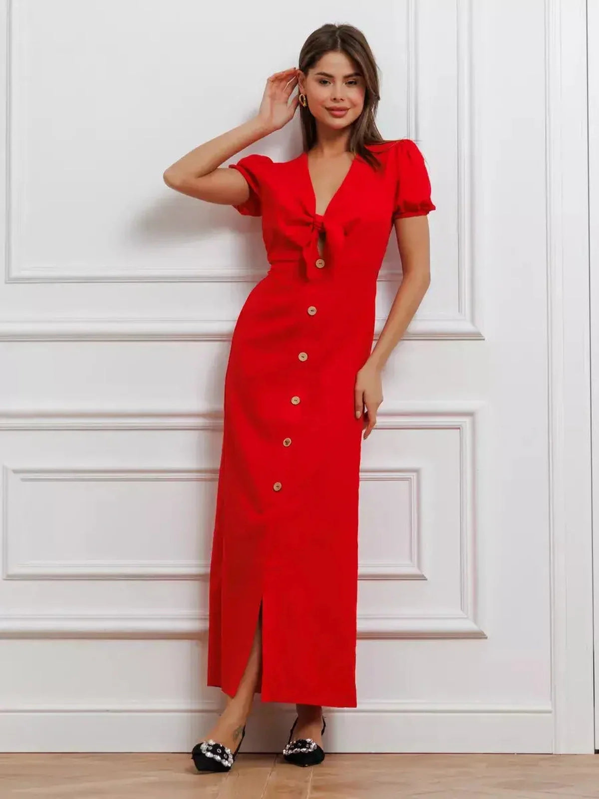 Maxi Dress Riviera Flame in bold red, featuring tie-front bodice, puff sleeves, and a sophisticated button-down design.