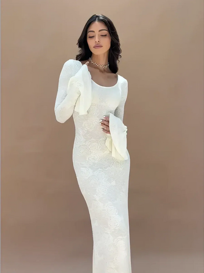 Floral Elegance Maxi Dress featuring sculpted fit, statement sleeves, and feminine silhouette in white floral jacquard knit.